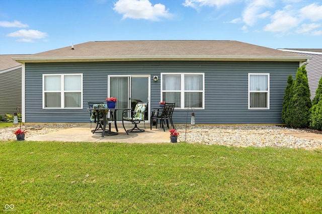 6315 Emerald Field Way, Indianapolis, IN 46221 - back of house with a patio area and a lawn