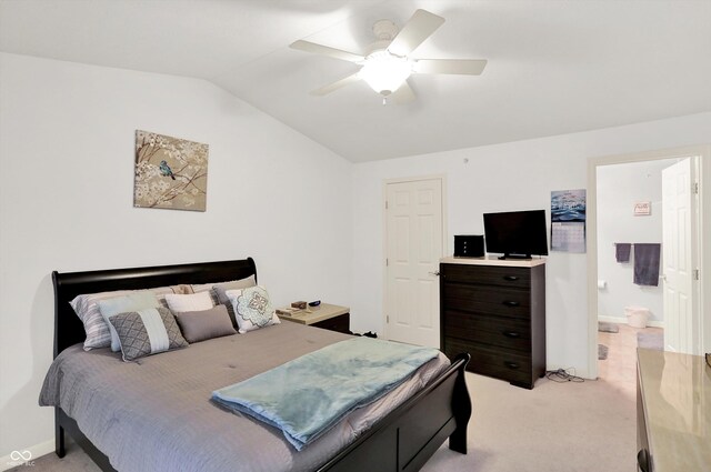 5011 Amber Creek Pl Unit 310, Indianapolis, IN 46237 - bedroom with vaulted ceiling, light carpet, a ceiling fan, and ensuite bathroom