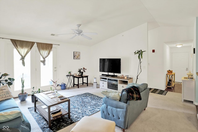 5011 Amber Creek Pl Unit 310, Indianapolis, IN 46237 - living room with vaulted ceiling, a ceiling fan, and light colored carpet