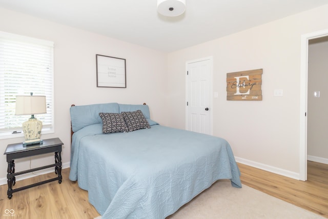 8429 Catamaran Dr, Indianapolis, IN 46236 - bedroom featuring light wood-style floors and baseboards
