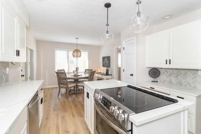 8429 Catamaran Dr, Indianapolis, IN 46236 - kitchen with stainless steel appliances, tasteful backsplash, white cabinets, light wood finished floors, and light stone counters