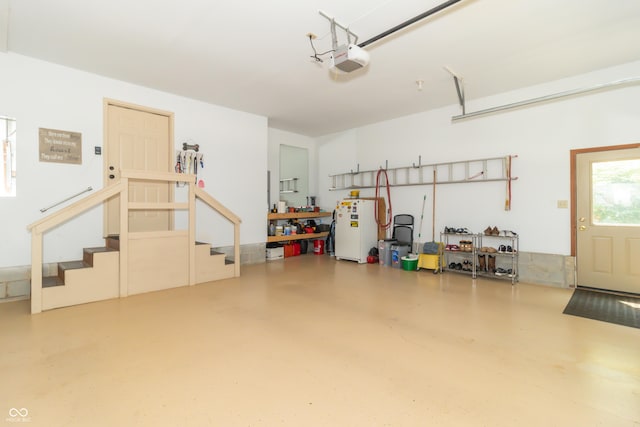 8429 Catamaran Dr, Indianapolis, IN 46236 - garage with freestanding refrigerator and a garage door opener
