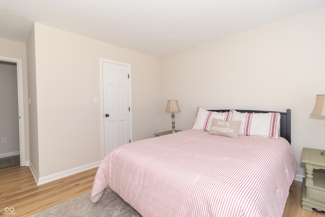 8429 Catamaran Dr, Indianapolis, IN 46236 - bedroom featuring light wood-type flooring and baseboards