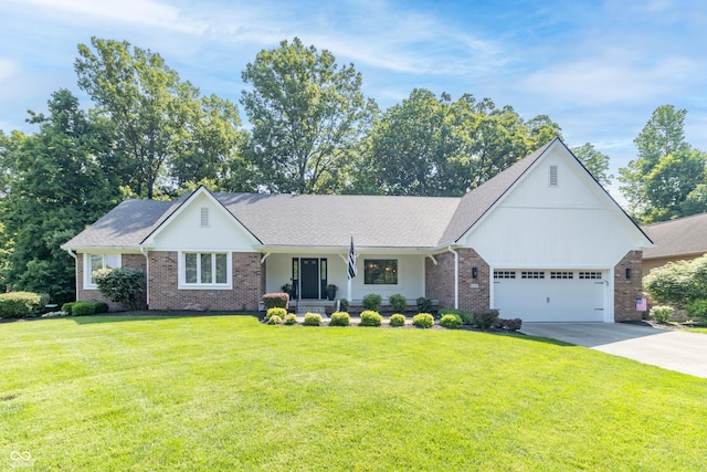 8429 Catamaran Dr, Indianapolis, IN 46236 - view of front facade with a garage, brick siding, a front yard, driveway, and covered porch
