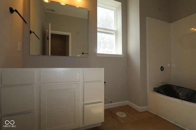 12524 Morning Ridge Way, Noblesville, IN 46060 - full bath with wood finished floors, vanity, and washtub / shower combination