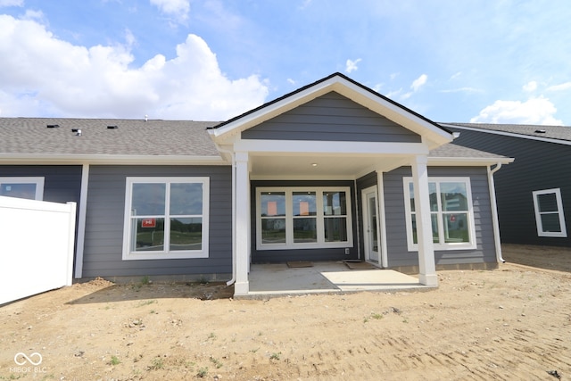 12524 Morning Ridge Way, Noblesville, IN 46060 - back of property with a shingled roof and a patio