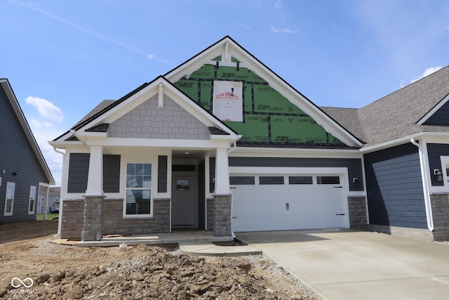 12524 Morning Ridge Way, Noblesville, IN 46060 - craftsman-style home with stone siding, a porch, concrete driveway, and an attached garage