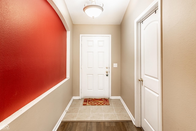 8116 Harshaw Dr, Indianapolis, IN 46239 - doorway to outside with baseboards and wood finished floors