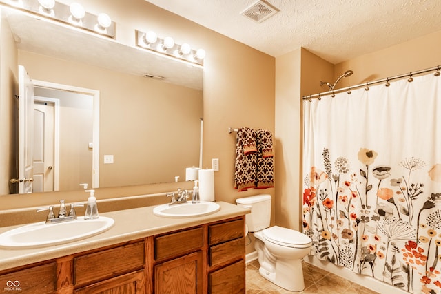 8116 Harshaw Dr, Indianapolis, IN 46239 - full bath with double vanity, tile patterned floors, curtained shower, and a textured ceiling
