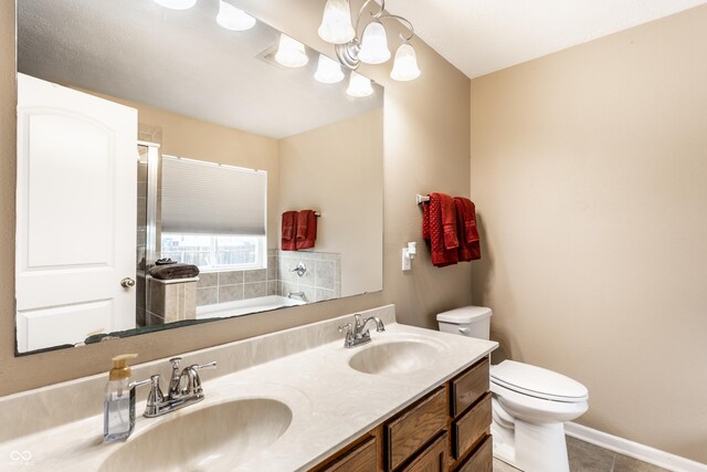 8116 Harshaw Dr, Indianapolis, IN 46239 - full bath featuring a garden tub, double vanity, and tile patterned floors