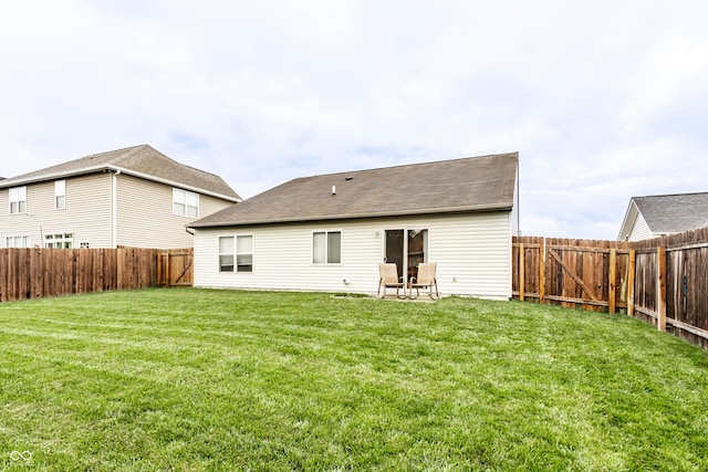 8116 Harshaw Dr, Indianapolis, IN 46239 - rear view of house with a fenced backyard