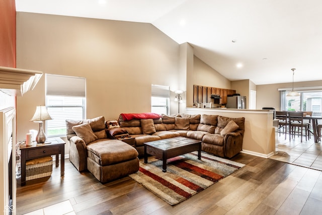 8116 Harshaw Dr, Indianapolis, IN 46239 - living area with wood-type flooring and high vaulted ceiling