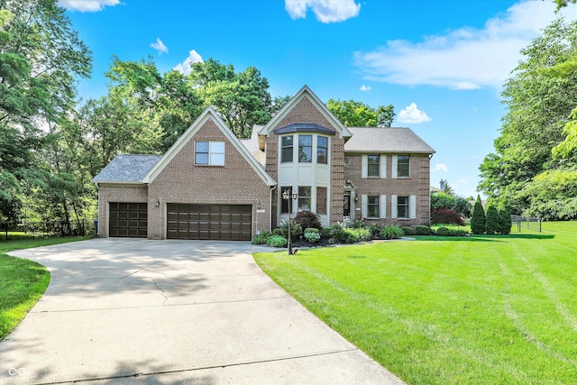 8261 Twin Pointe Cir, Indianapolis, IN 46236 - view of front of property with brick siding, a front lawn, and concrete driveway