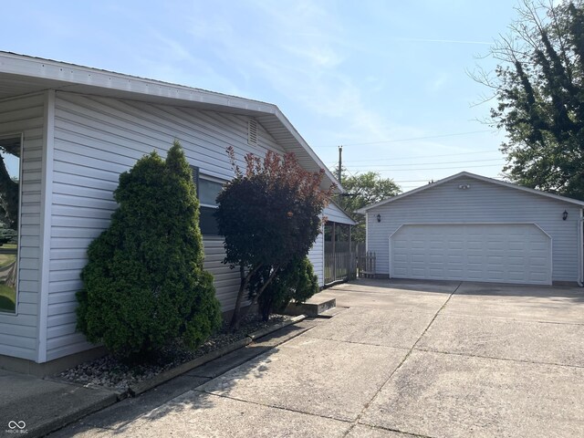 737 Howard St, Shelbyville, IN 46176 - view of side of home featuring a detached garage and an outdoor structure