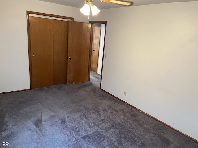 737 Howard St, Shelbyville, IN 46176 - unfurnished bedroom featuring carpet floors, a closet, and a ceiling fan