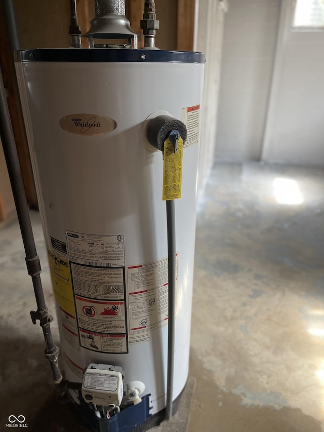 737 Howard St, Shelbyville, IN 46176 - utility room featuring gas water heater