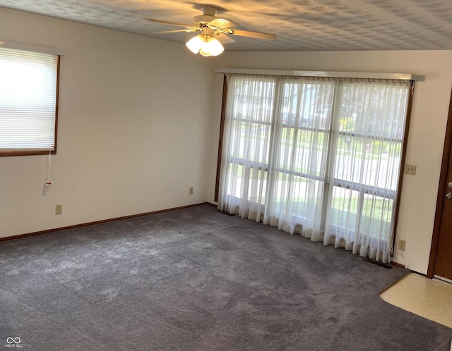 737 Howard St, Shelbyville, IN 46176 - unfurnished room featuring carpet flooring, plenty of natural light, ceiling fan, and a textured ceiling