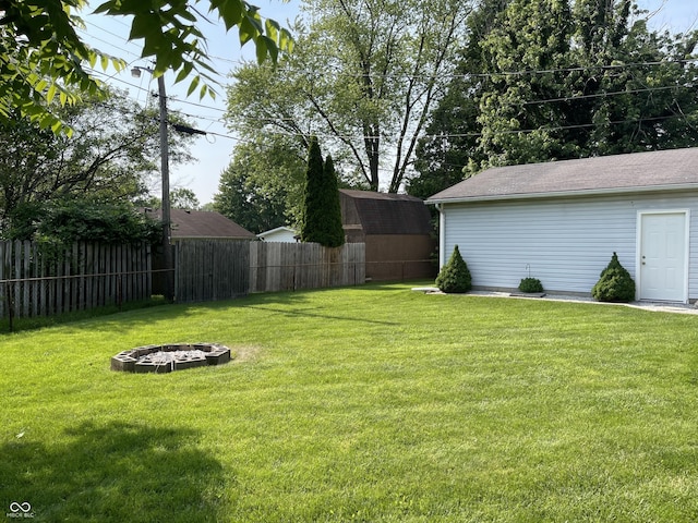 737 Howard St, Shelbyville, IN 46176 - view of yard with an outdoor fire pit and a storage shed