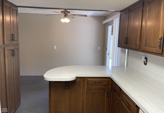 737 Howard St, Shelbyville, IN 46176 - kitchen with a peninsula, ceiling fan, light countertops, and carpet floors