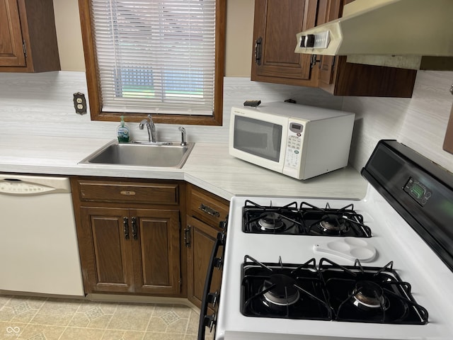 737 Howard St, Shelbyville, IN 46176 - kitchen featuring white appliances, light countertops, ventilation hood, and dark brown cabinets