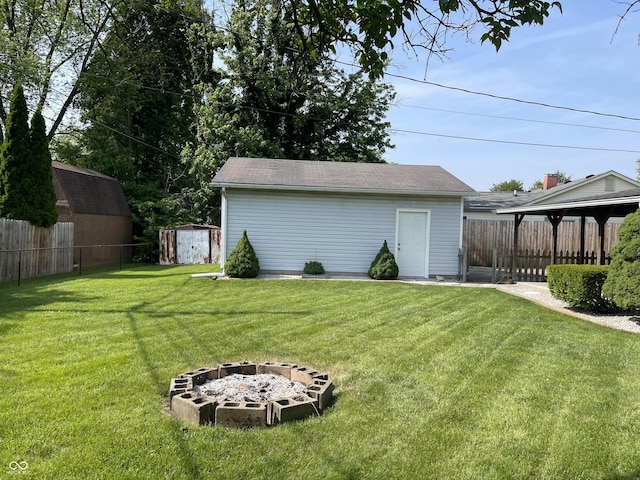 737 Howard St, Shelbyville, IN 46176 - view of yard with a storage shed and a fire pit