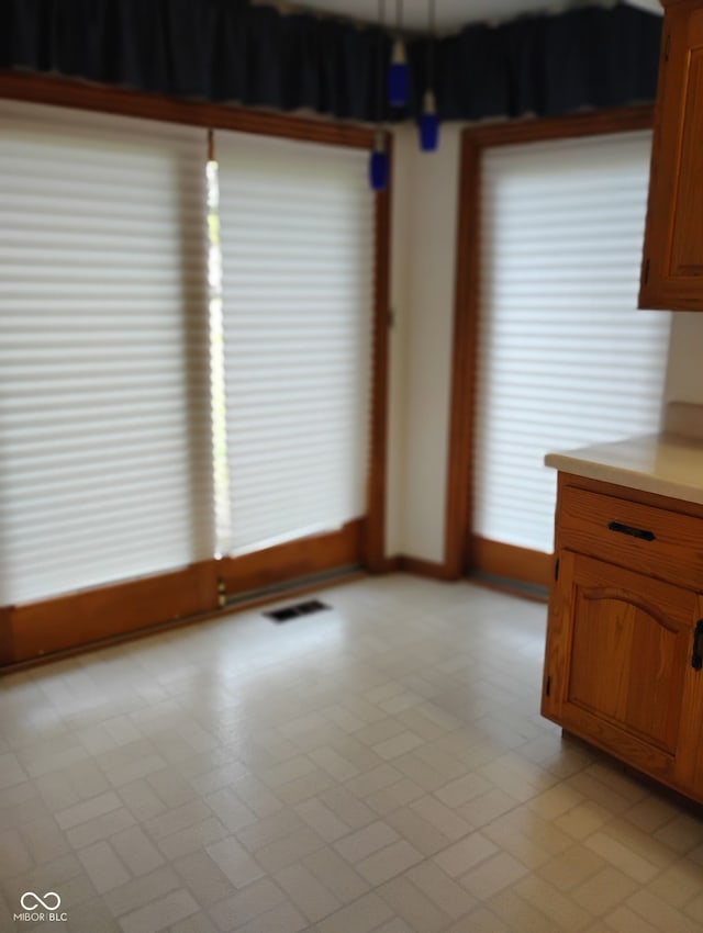 721 Maplewood Ave, Anderson, IN 46012 - unfurnished dining area with baseboards