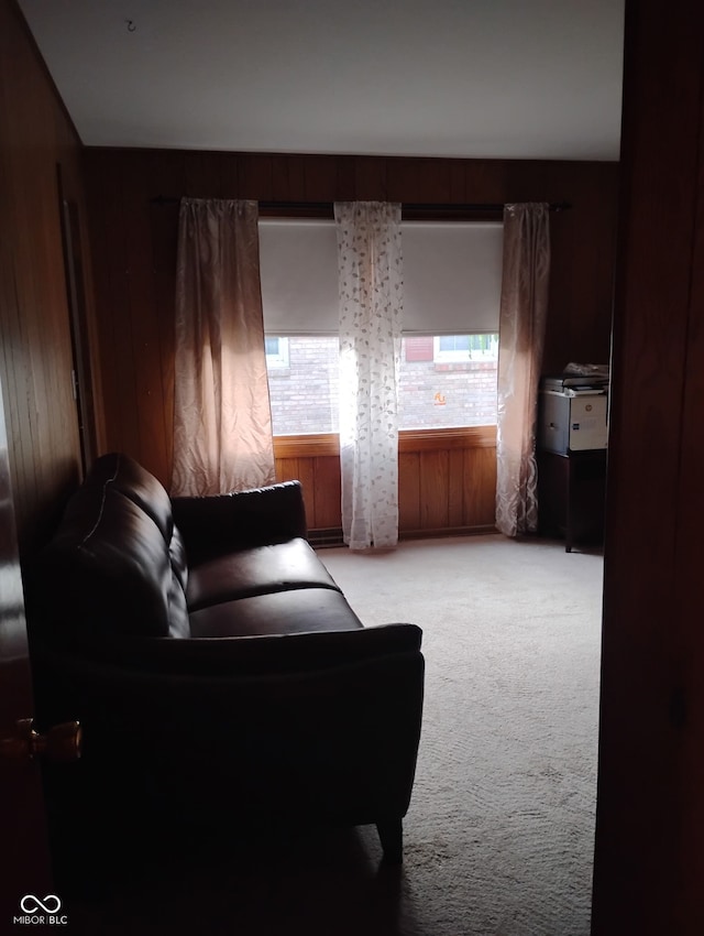 721 Maplewood Ave, Anderson, IN 46012 - living area featuring light carpet, healthy amount of natural light, and wooden walls
