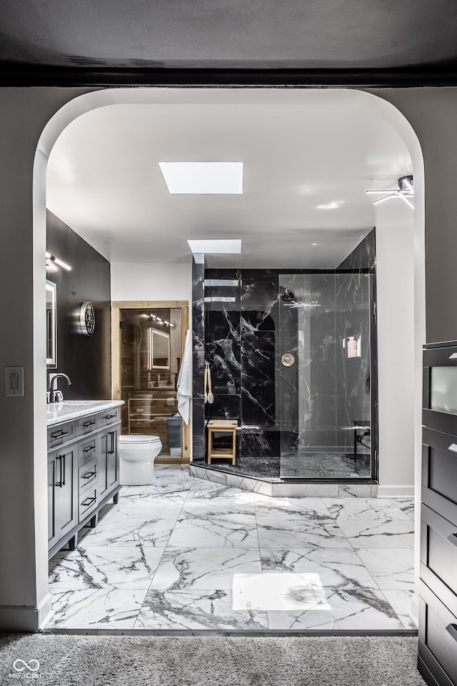 6164 Afton Crst, Indianapolis, IN 46220 - full bathroom with marble finish floors, vanity, a marble finish shower, and a skylight