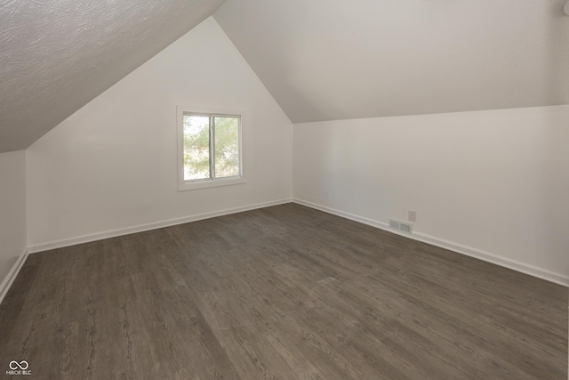 12003 Broadway St, Indianapolis, IN 46236 - additional living space with dark wood-style floors and vaulted ceiling
