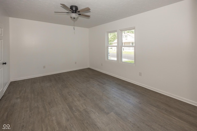 12003 Broadway St, Indianapolis, IN 46236 - unfurnished room featuring dark wood-style flooring, ceiling fan, and a textured ceiling