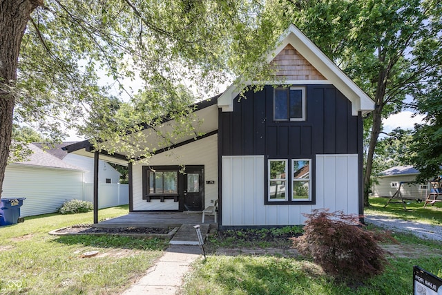 12003 Broadway St, Indianapolis, IN 46236 - modern farmhouse featuring board and batten siding, covered porch, and a front yard
