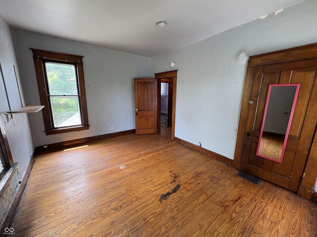 807 N Elm St, Muncie, IN 47305 - empty room featuring wood finished floors and baseboards