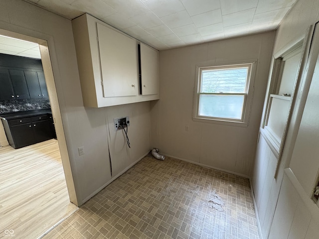 807 N Elm St, Muncie, IN 47305 - washroom featuring cabinet space and brick patterned flooring
