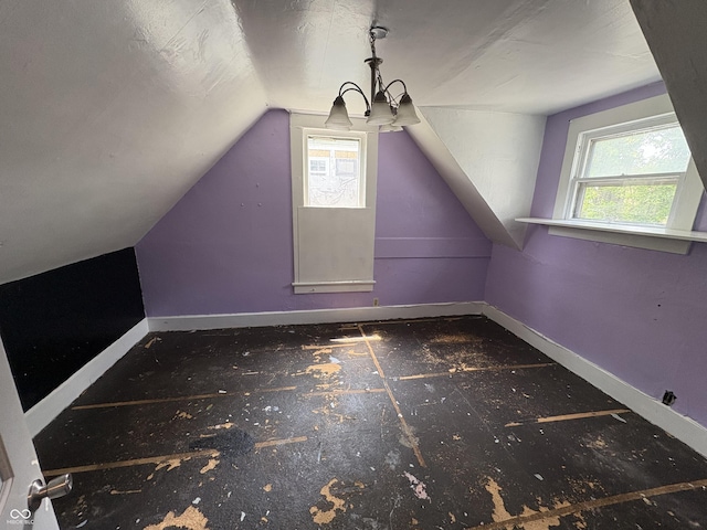 807 N Elm St, Muncie, IN 47305 - bonus room with healthy amount of natural light, lofted ceiling, and a chandelier