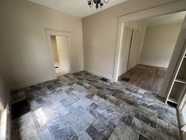 807 N Elm St, Muncie, IN 47305 - spare room with stone finish floors