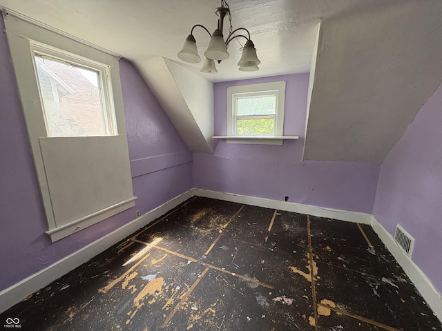 807 N Elm St, Muncie, IN 47305 - additional living space with lofted ceiling and a chandelier