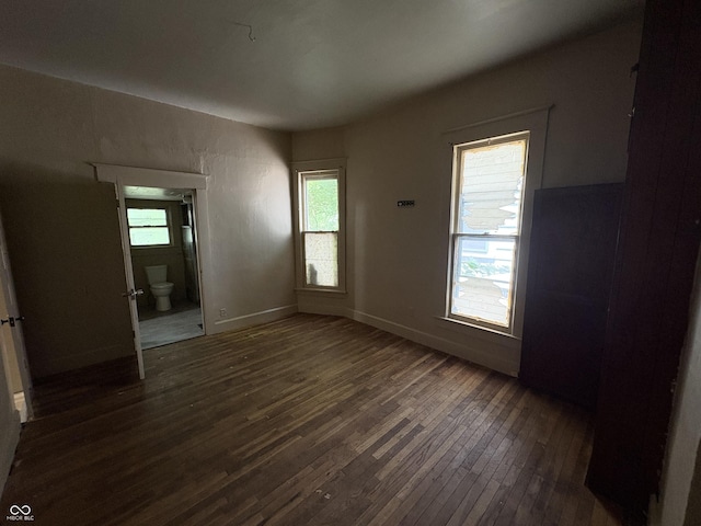 807 N Elm St, Muncie, IN 47305 - spare room featuring dark wood-style flooring and healthy amount of natural light