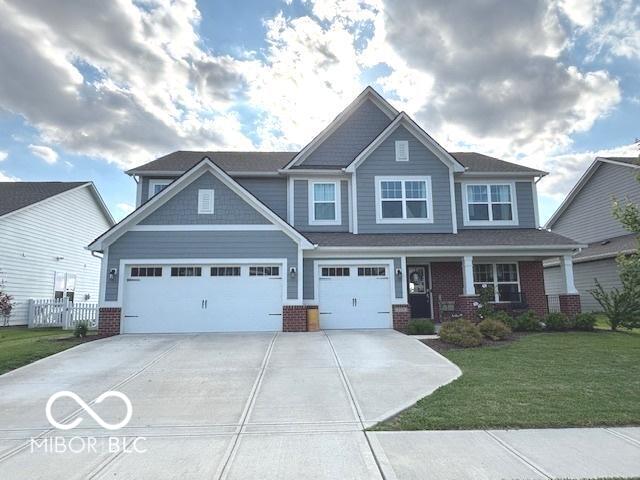 520 Ferndale Ln, Danville, IN 46122 - craftsman inspired home featuring driveway, brick siding, and an attached garage