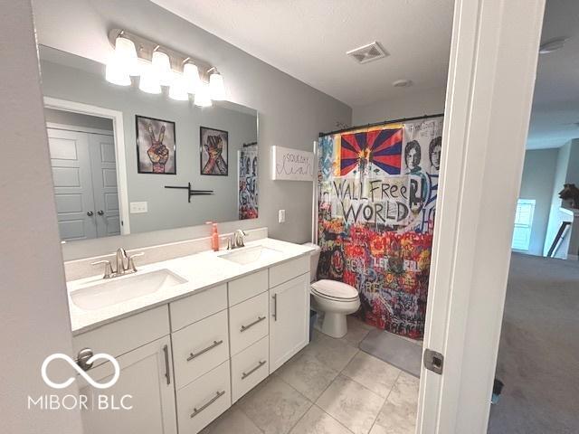 520 Ferndale Ln, Danville, IN 46122 - bathroom featuring double vanity, a shower with shower curtain, and tile patterned floors