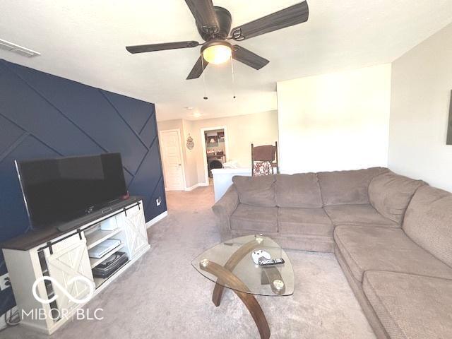 520 Ferndale Ln, Danville, IN 46122 - living room featuring carpet floors and ceiling fan