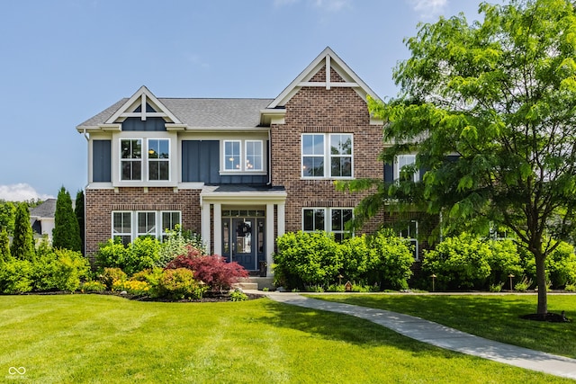 16310 Nightshore Ln, Fishers, IN 46037 - view of front of property featuring a front yard, board and batten siding, brick siding, and a shingled roof