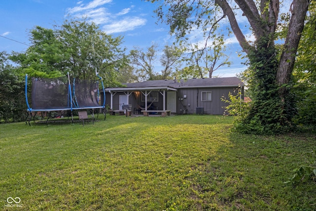 3509 N Wittfield St, Indianapolis, IN 46235 - view of green lawn featuring a trampoline