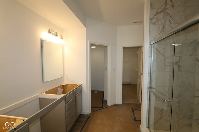 12532 Morning Ridge Way, Noblesville, IN 46060 - bathroom with a marble finish shower, vanity, and a walk in closet