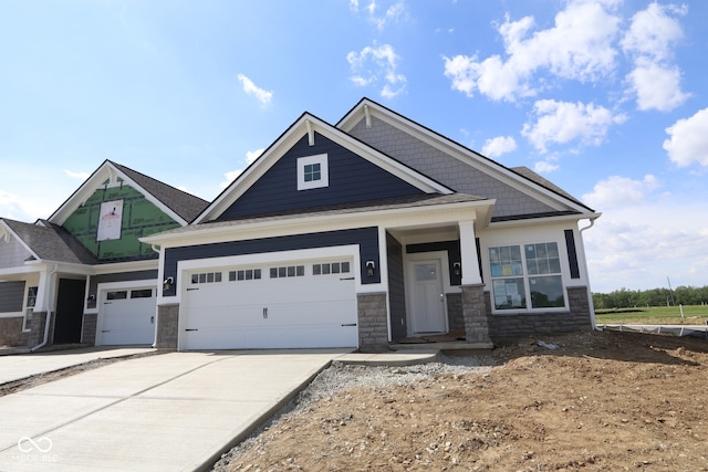 12532 Morning Ridge Way, Noblesville, IN 46060 - craftsman inspired home featuring stone siding, concrete driveway, and an attached garage