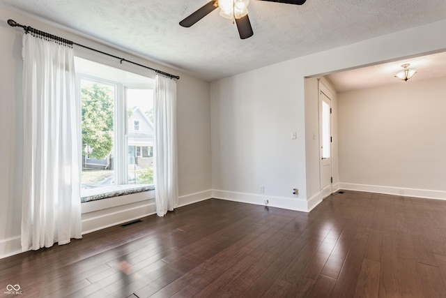 525 Orange St, Indianapolis, IN 46203 - empty room featuring a ceiling fan, dark wood-type flooring, and a textured ceiling