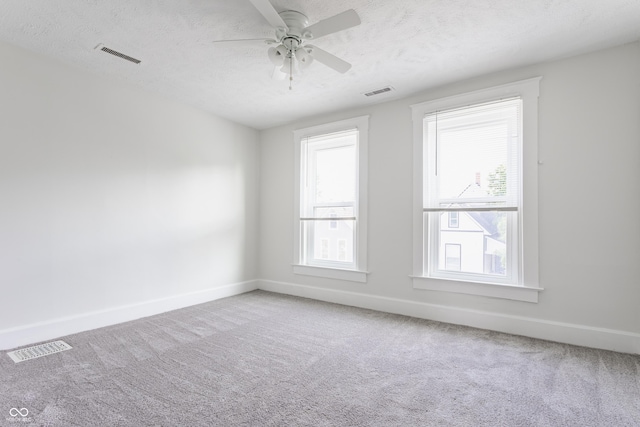 525 Orange St, Indianapolis, IN 46203 - empty room featuring carpet, ceiling fan, and a textured ceiling
