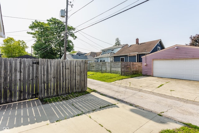 525 Orange St, Indianapolis, IN 46203 - view of patio with an outdoor structure and a detached garage