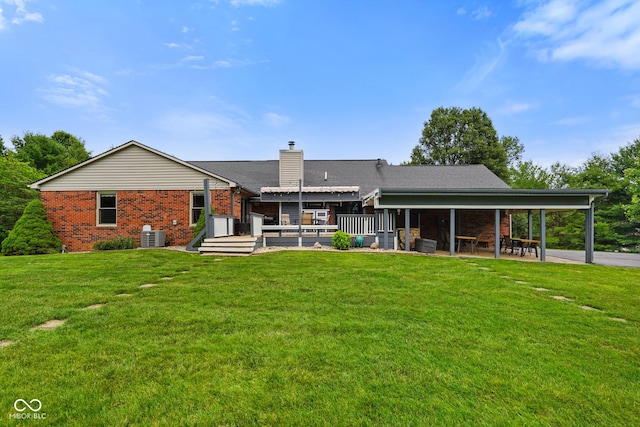 12196 N Beth Ann Dr, Camby, IN 46113 - rear view of property featuring brick siding, a chimney, a lawn, and a deck
