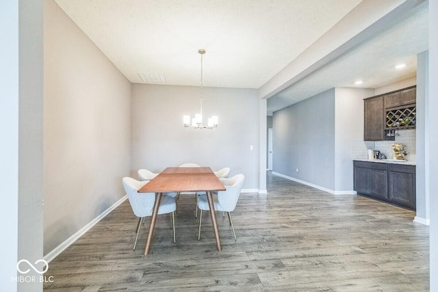 1758 Pelham Dr, Greenwood, IN 46143 - dining area with a chandelier, light wood-style floors, and recessed lighting