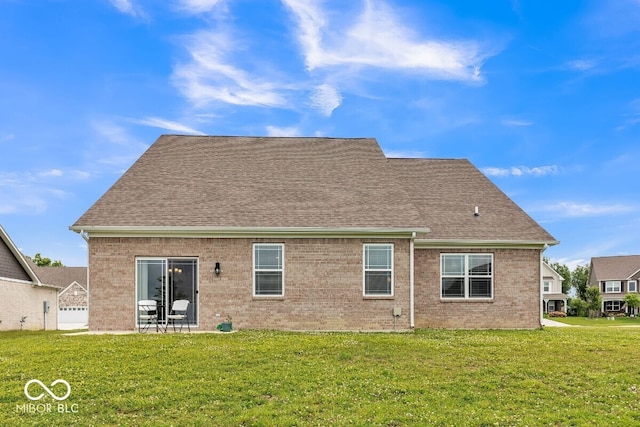 1758 Pelham Dr, Greenwood, IN 46143 - back of property with a yard, brick siding, and a shingled roof